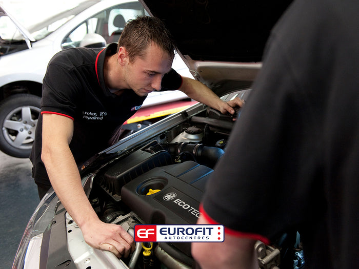 Eurofit Autocentres technician looking in car bonnet at engine